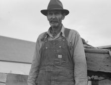 Stump farmer comes to town on a Saturday morning to bring in cream..., Bonners Ferry, Idaho, 1939. Creator: Dorothea Lange