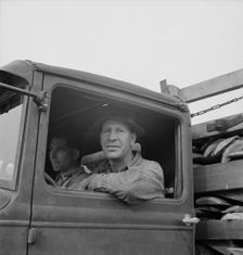 Stump farmer hauling load of slab wood for sale in town, Bonner County, Idaho, 1939. Creator: Dorothea Lange