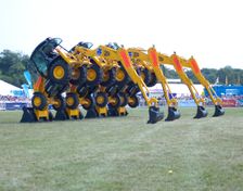 Stunt JCB diggers perfoming formation "dance" routine at New Forest show 2006. Creator: Unknown