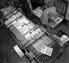 Stacking finished brochures at a printers, Mexborough, South Yorkshire, 1959. Creator: Michael Walters