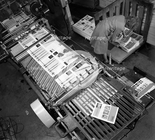 Stacking finished brochures at a printers, Mexborough, South Yorkshire, 1959. Creator: Michael Walters.