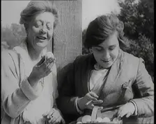 Stage Star Syndey Fairbrother Collecting Hen Eggs on Her Farm, 1920s. Creator: British Pathe Ltd