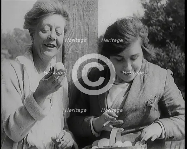 Stage Star Syndey Fairbrother Collecting Hen Eggs on Her Farm, 1920s. Creator: British Pathe Ltd.