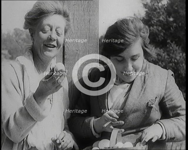 Stage Star Syndey Fairbrother Collecting Hen Eggs on Her Farm, 1920s. Creator: British Pathe Ltd.