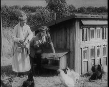 Stage Star Syndey Fairbrother Collecting Hen Eggs on Her Farm, 1920s. Creator: British Pathe Ltd
