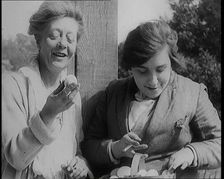 Stage Star Syndey Fairbrother Collecting Hen Eggs on Her Farm, 1920s. Creator: British Pathe Ltd