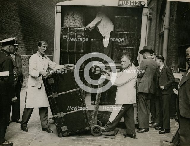 Staff from Bishop & Sons Depositories Ltd unload a case at Burlington House, 1935. Creator: Topical Press Agency.