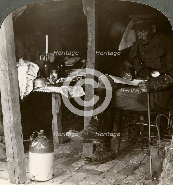 Staff officer in a dugout studying details before an offensive, World War I, 1914-1918Artist: Realistic Travels Publishers