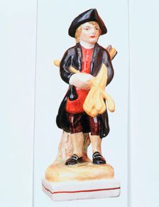 Staffordshire golfing figure, c1900. Creator: Unknown