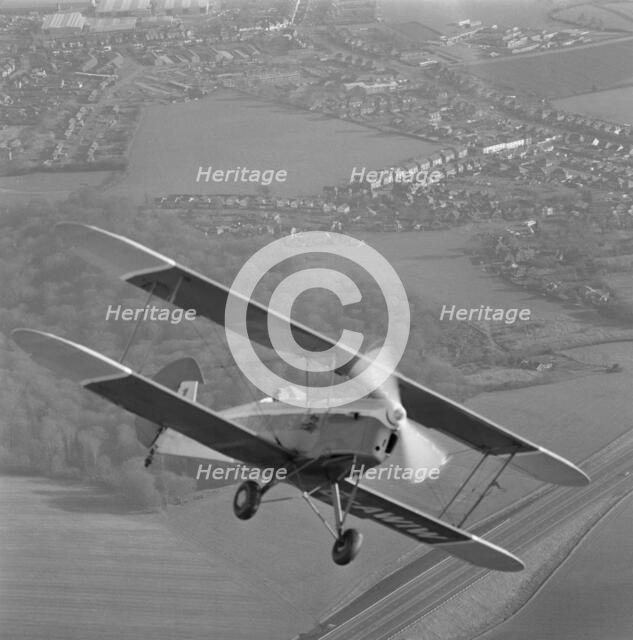 Stampe biplane in flight, 20th century. Artist: Aerofilms.