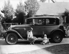 Stan Laurel at the wheel of 1927 Hupmobile with his wife Lois and daughter Lois