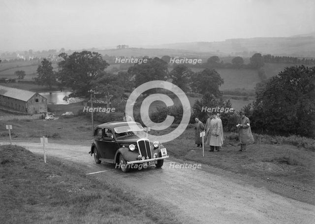 Standard 12 saloon of Miss I Webber competing in the South Wales Auto Club Welsh Rally, 1937 Artist: Bill Brunell.