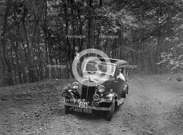 Standard competing in the B&HMC Brighton-Beer Trial, Fingle Bridge Hill, Devon, 1934. Artist: Bill Brunell.