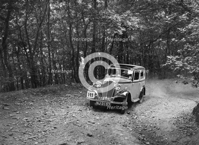 Standard competing in the B&HMC Brighton-Beer Trial, Fingle Bridge Hill, Devon, 1934. Artist: Bill Brunell.