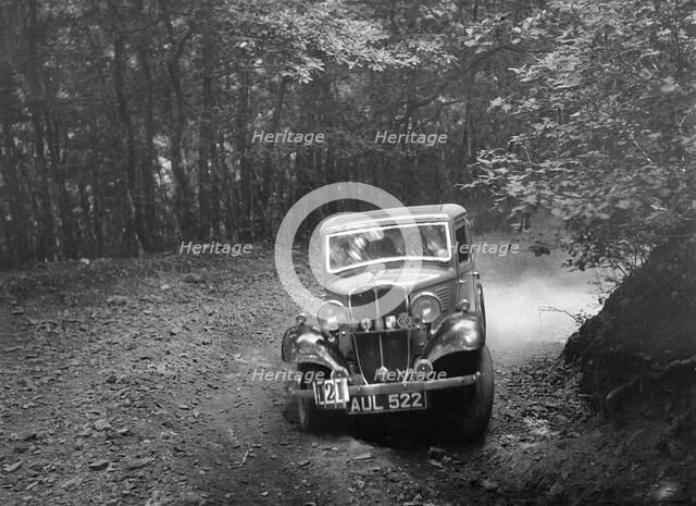 Standard Little Nine saloon, B&HMC Brighton-Beer Trial, Fingle Bridge Hill, Devon, 1934. Artist: Bill Brunell.