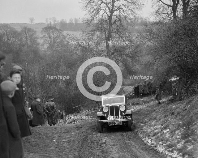 Standard Nine saloon of Mrs M Vaughan competing in the Sunbac Colmore Trial, Gloucestershire, 1933. Artist: Bill Brunell.