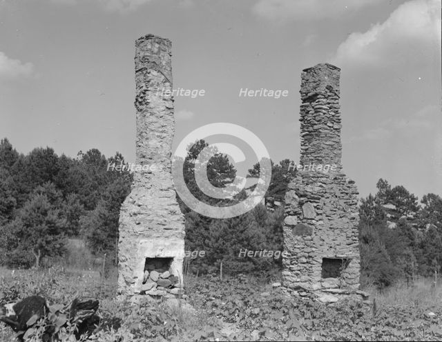 Standing chimneys of an old plantation house, Georgia, 1937. Creator: Dorothea Lange.
