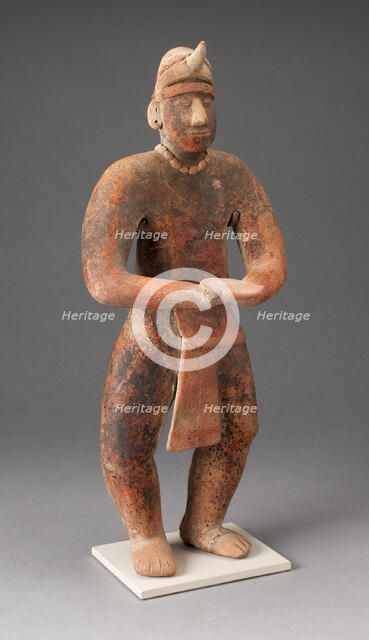 Standing Male Figure Holding a Plate, A.D. 100/400. Creator: Unknown.