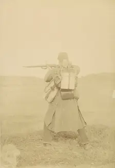 [Standing Soldier Aiming Rifle], 1880s-90s. Creator: Unknown