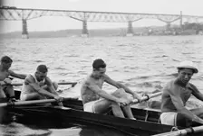 Stanford University crew rowing on Hudson River with Poughkeepsie Bridge..., between c1910-c1915. Creator: Bain News Service