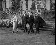 Stanley Baldwin, the British Prime Minister Walking from Himley Hall with Others, 1930s. Creator: British Pathe Ltd