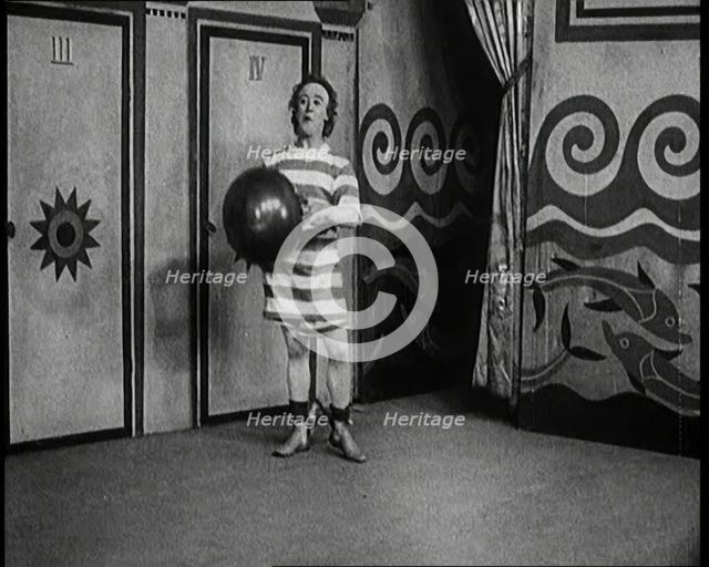Stanley Lupino Performing in a Show in London Wearing a Stripy Bathing Suit, 1922. Creator: British Pathe Ltd.