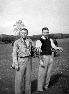 Stanley Matthews and Eddie Hapgood pause between shots during a round of golf, 1945
