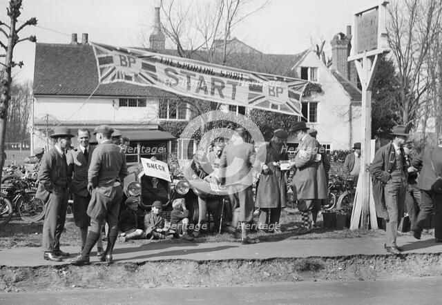 Start line for the Surbiton Motor Club Grand Cup, the Talbot Hotel, Ripley, Surrey, 1929. Artist: Bill Brunell.