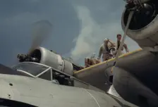 Starting a propeller at the Naval Air Base, Corpus Christi, Texas, 1942. Creator: Howard Hollem