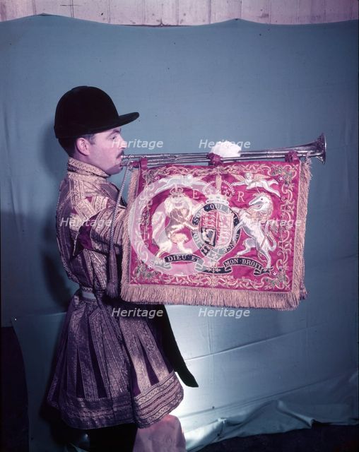 State trumpeter with 'ER' cypher on banner, side view, London, c1953. Creator: Arthur Charles Kirby Ware.
