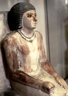 Statue of a seated man, in polychromed limestone