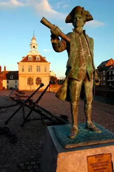 Statue of Captain Vancouver at dusk on the Purfleet Quay, King's Lynn, Norfolk. Creator: Peter Thompson