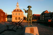 Statue of Captain Vancouver at dusk on the Purfleet Quay, King's Lynn, Norfolk. Creator: Peter Thompson