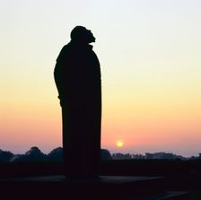 Statue of Danish astronomer Tycho Brahe at sunset, Uranienborg, Ven, Sweden. Creator: Per Eliasson