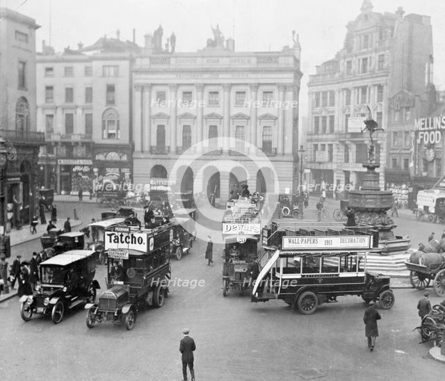 Statue of Eros and traffic in Piccadilly Circus, Westminster, London, (c1910s?). Creator: Unknown.
