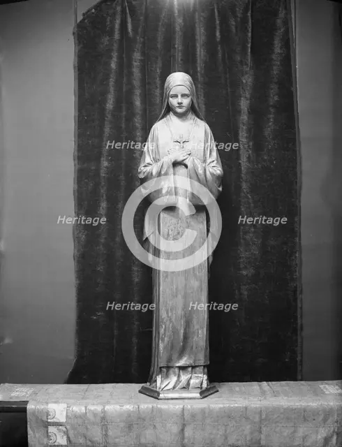 Statue of St. Theresa by Mario Korbel, between 1914 and 1928. Creators: Arnold Genthe, Mario Korbel.