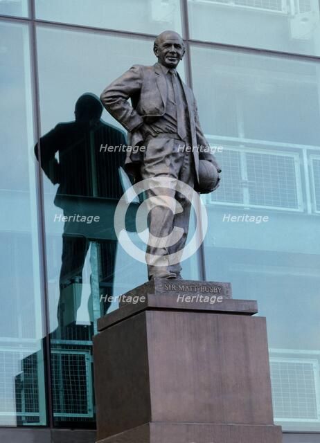 Statue of Sir Matt Busby outside Old Trafford football stadium, Manchester, c2000s. Artist: Historic England Staff Photographer.