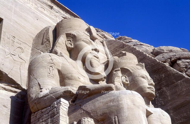 Statues of Rameses II, in front of the main temple, Abu Simbel, Egypt, early 13th century BC. Artist: Unknown