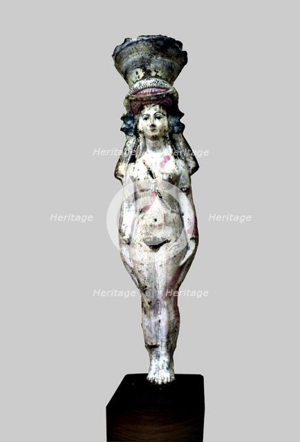 Statuette identified as Hathor - Aphrodite, made in painted terracotta.