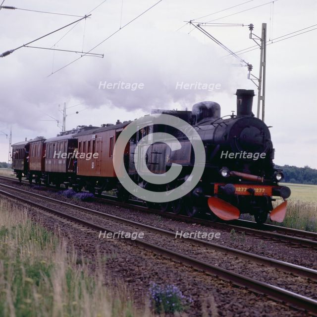 Steam locomotive 1277 and passenger cars, museum railway, Sweden, 1960s.
 Creator: Unknown.