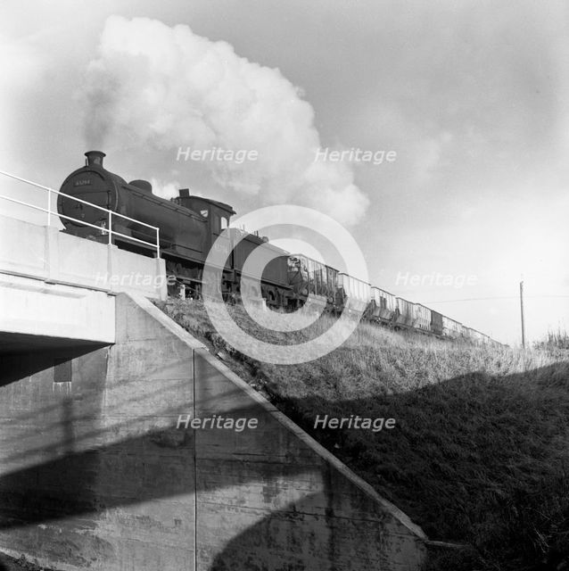 Steam loco no 65794 hauling coal from Lynemouth Colliery, Northumberland, 1963.  Artist: Michael Walters