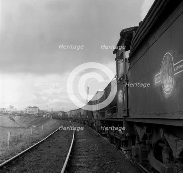 Steam loco no 65811 hauling coal from Lynemouth Colliery, Northumberland, 1963.  Artist: Michael Walters