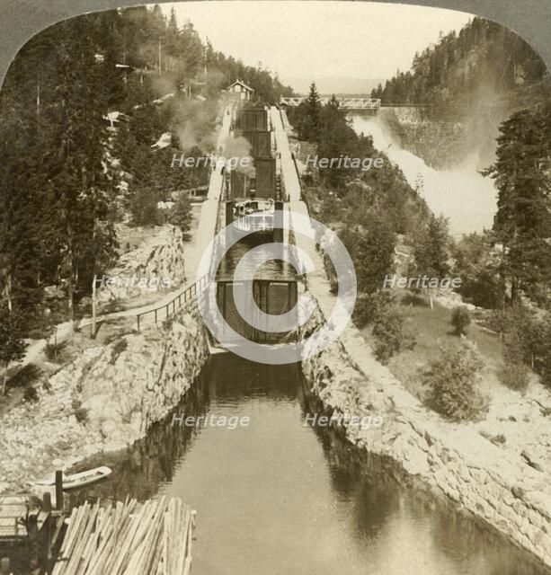 'Steamboat climbing a hill beside Vrang waterfall, by locks in  Bandak-Nordsjo, Norway', c1905. Creator: Unknown.