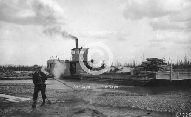 Steamer Little Delta and barge on sand bar, between c1900 and c1930. Creator: Unknown.