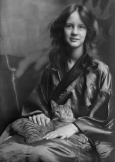 Stebbins, Jocelyn, Miss (Mrs. Fletcher), and Buzzer the cat, portrait photograph, 1912 or 1913. Creator: Arnold Genthe