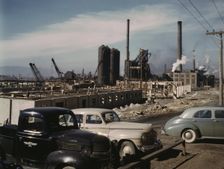 Steel and concrete go into place rapidly as a new steel...Columbia Steel Co., Geneva, Utah, 1942. Creator: Andreas Feininger