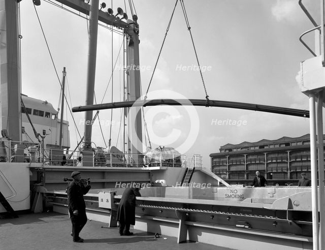 Steel bars being loaded onto the 'Manchester Renown', Manchester, 1964. Creator: Michael Walters.