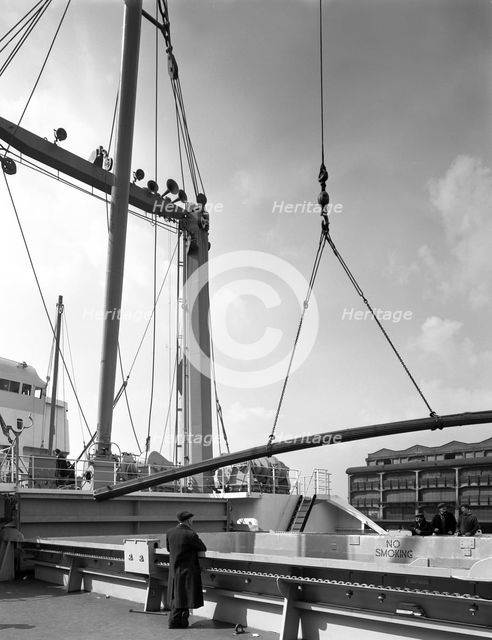Steel bars being loaded onto the 'Manchester Renown', Manchester, 1964. Creator: Michael Walters.