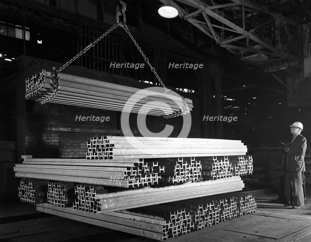 Steel 'H' girders being stacked for distribution, Park Gate, Rotherham, South Yorkshire, 1964. Creator: Michael Walters.