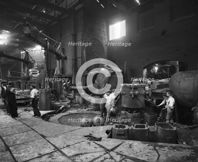 Steel production at the Cammell Laird works, Penistone, Yorkshire, 1913. Artist: H Bedford Lemere.